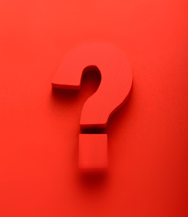 big question mark on a red background, to ask the question 'how does soreto compare to traditional referral platforms'